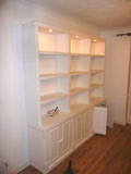 A whole wall of book/storage shelves